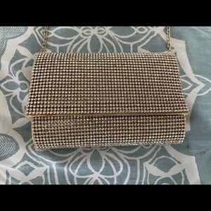 Clear rhinestone adorned gold crossbody/clutch
